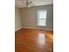Bedroom featuring hardwood floors, neutral paint, natural light, and ceiling fan for added comfort at 524 Railroad Nw Dr, Concord, NC 28025