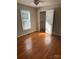 Comfortable bedroom with hardwood floors, walk in closet, and ample natural light, a serene retreat at 524 Railroad Nw Dr, Concord, NC 28025