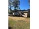 Ranch-style house featuring vinyl siding, wood trim, and a charming back porch and yard at 524 Railroad Nw Dr, Concord, NC 28025
