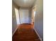 Bright hallway with hardwood floors, connecting the various rooms of this comfortable home at 524 Railroad Nw Dr, Concord, NC 28025