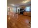 Kitchen with stainless steel appliances, hardwood floors and view into living space at 524 Railroad Nw Dr, Concord, NC 28025
