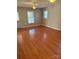 Bright living room with hardwood floors, natural light, and ceiling fan, offering a welcoming space at 524 Railroad Nw Dr, Concord, NC 28025