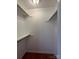 Spacious walk-in closet with shelving, offering ample storage for an organized home at 524 Railroad Nw Dr, Concord, NC 28025