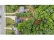 Aerial view of the property highlighting landscaping, a backyard patio, and driveway at 5625 Linda Vista Ln, Charlotte, NC 28216
