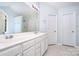Bright bathroom showcasing double sinks, and a large mirror, for a luxurious feel at 5625 Linda Vista Ln, Charlotte, NC 28216