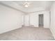 Spacious main bedroom featuring tray ceiling, ceiling fan, and neutral carpet, for an inviting space at 5625 Linda Vista Ln, Charlotte, NC 28216