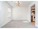 Bright dining room with chandelier lighting and neutral carpet, perfect for entertaining at 5625 Linda Vista Ln, Charlotte, NC 28216