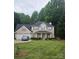 Charming two-story brick home with a well-manicured lawn and attached two-car garage at 5625 Linda Vista Ln, Charlotte, NC 28216