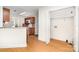 Open-concept kitchen with wood cabinets, stainless steel appliances, and pantry at 5625 Linda Vista Ln, Charlotte, NC 28216