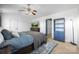 Bright bedroom featuring a ceiling fan, TV, and blue accents at 6107 Raisin Tree Ln, Charlotte, NC 28215