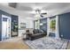 Bonus room with lots of natural light and plush furniture at 6107 Raisin Tree Ln, Charlotte, NC 28215