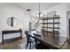 Dining area featuring a wooden table, chandelier, console table and decorative mirror at 6107 Raisin Tree Ln, Charlotte, NC 28215