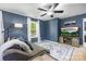 Comfortable living room with a TV, ceiling fan, and natural light from the window at 6107 Raisin Tree Ln, Charlotte, NC 28215