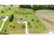 Drone view showing a home with a long driveway, set within a well-maintained, spacious lot at 6201 New Hope Church Rd, Marshville, NC 28103