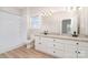 Bathroom with granite counters, double sinks, and wooden floor at 6201 New Hope Church Rd, Marshville, NC 28103