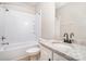 Clean bathroom featuring a shower-tub combo, modern vanity with granite countertop, and neutral color scheme at 6201 New Hope Church Rd, Marshville, NC 28103