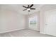 Bright bedroom features a ceiling fan and neutral carpet and paint at 6201 New Hope Church Rd, Marshville, NC 28103