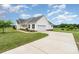 Spacious home featuring an attached garage and long driveway on a large lot with mature trees at 6201 New Hope Church Rd, Marshville, NC 28103