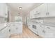 Bright kitchen boasts granite counters, white cabinets, and modern appliances at 6201 New Hope Church Rd, Marshville, NC 28103