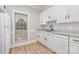 Kitchen with all white cabinets, stainless steel faucet, and granite counters at 6201 New Hope Church Rd, Marshville, NC 28103