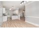 Open-concept living room with wood floors, natural light, and stylish fixtures at 6201 New Hope Church Rd, Marshville, NC 28103