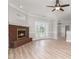 Inviting living room with fireplace, wood floors, and French doors leading to the backyard at 6201 New Hope Church Rd, Marshville, NC 28103