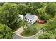 Aerial view of a two-story home with well-maintained yard surrounded by lush greenery in a peaceful neighborhood at 641 Saratoga Dr, Clover, SC 29710