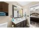 Updated bathroom features a double vanity, updated fixtures, and a framed mirror at 641 Saratoga Dr, Clover, SC 29710