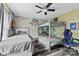 Shared bedroom with ceiling fan, wood-look flooring, guitars and bunk bed at 641 Saratoga Dr, Clover, SC 29710