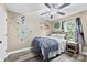 Bedroom with queen bed, ceiling fan and a large window to the outdoors at 641 Saratoga Dr, Clover, SC 29710