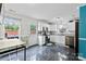 Bright kitchen featuring white cabinets, stainless steel appliances, and dark floors with lots of natural light at 641 Saratoga Dr, Clover, SC 29710