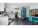 Well lit kitchen featuring stainless steel appliances, stone countertops, and dark tile flooring at 641 Saratoga Dr, Clover, SC 29710