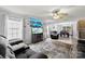 Spacious living room with a plush gray sofa, large rug, and media setup featuring a big-screen TV at 641 Saratoga Dr, Clover, SC 29710