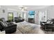 Comfortable living room showcasing plush gray seating, a large rug, and a mounted TV with decorative touches at 641 Saratoga Dr, Clover, SC 29710