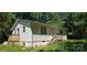 Cozy single-Gathering home featuring vinyl siding and a small front porch with wooden steps at 6653 Mountain Grove Rd, Hickory, NC 28658