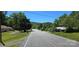 Open street view featuring trees and landscaping, with a glimpse of a mountain in the distance at 6653 Mountain Grove Rd, Hickory, NC 28658
