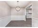 Cozy dining area featuring modern lighting and flows into the kitchen at 7026 Quail Hill Rd, Charlotte, NC 28210