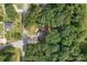 An aerial view of a home surrounded by large trees at 800 Woodlawn St, Belmont, NC 28012