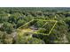Expansive property surrounded by lush greenery and mature trees, providing privacy and a sense of seclusion at 800 Woodlawn St, Belmont, NC 28012