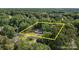 An aerial view of a house and surrounding trees, property lines are estimated at 800 Woodlawn St, Belmont, NC 28012