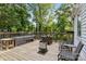Wooden deck with chairs and outdoor furniture; surrounded by trees at 800 Woodlawn St, Belmont, NC 28012