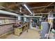 Basement workshop with exposed pipes and unfinished walls at 800 Woodlawn St, Belmont, NC 28012