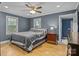 Comfortable bedroom featuring hardwood floors, two windows and ensuite bathroom at 800 Woodlawn St, Belmont, NC 28012