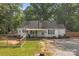 Charming single-Gathering home with a fenced yard and deck in a lush, green setting, offering comfortable outdoor living at 800 Woodlawn St, Belmont, NC 28012