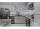 Contemporary kitchen design featuring stainless steel appliances and sleek countertops, creating a modern cooking space at 800 Woodlawn St, Belmont, NC 28012