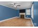 Spacious living area features hardwood floors, fireplace, and window providing natural light, perfect for relaxation at 800 Woodlawn St, Belmont, NC 28012