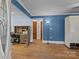A versatile living space with hardwood floors and neutral walls providing a clean canvas for personalization at 800 Woodlawn St, Belmont, NC 28012