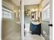 Bathroom featuring sink and vanity with shower stall and open shelving at 827 Fairbanks Rd, Charlotte, NC 28210