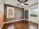 Bedroom featuring dark wood floors, built-in shelves, and natural light at 827 Fairbanks Rd, Charlotte, NC 28210