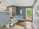 Bright entryway with hardwood floors, natural light, and view of a fenced backyard at 827 Fairbanks Rd, Charlotte, NC 28210